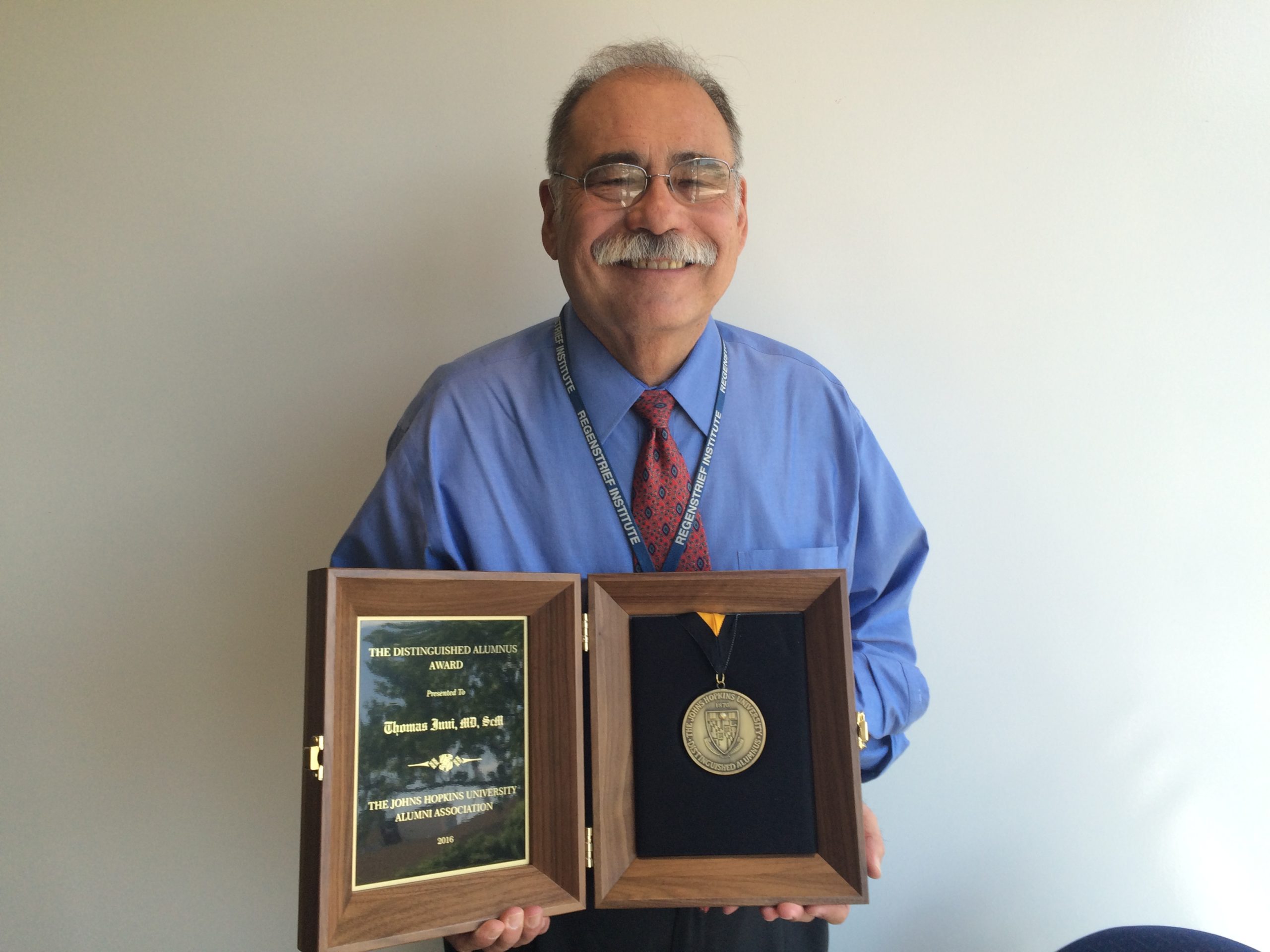 Dr. Tom Inui with Johns Hopkins University distinguished alum award