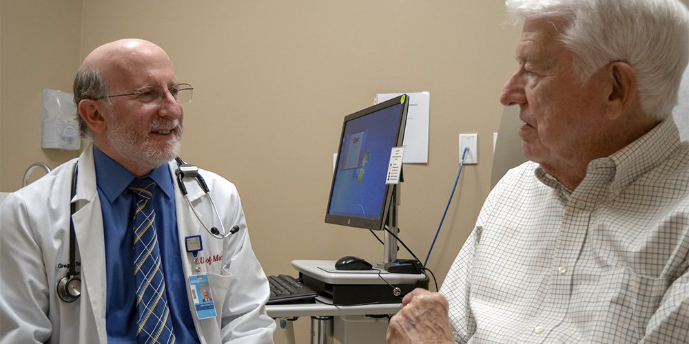Dr. Greg Sachs consulting with a patient
