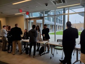 Attendees network to discuss implementing AI