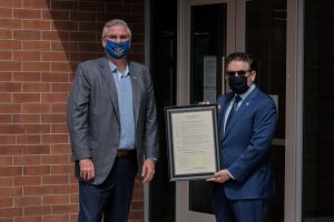 Dr. Peter Embi and Gov. Eric Holcomb with proclamation of Regenstrief awareness week