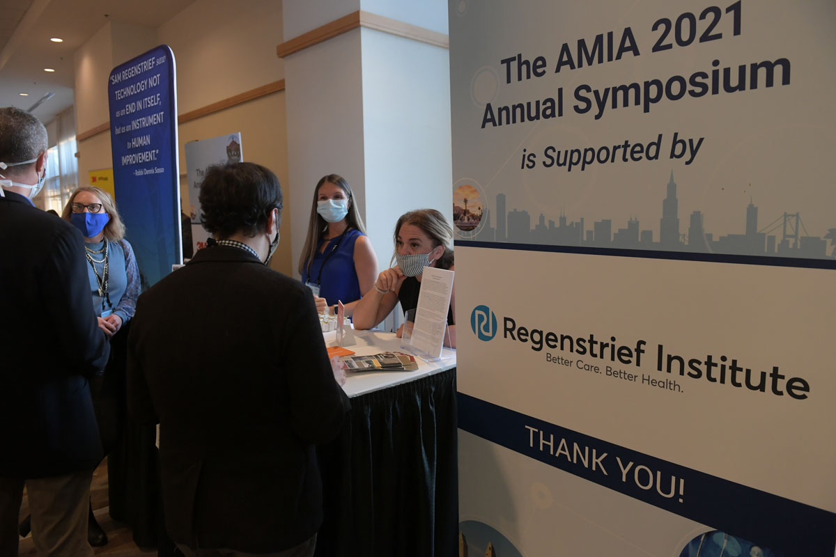 People at Regenstrief Institute booth at AMIA 2021 Annual Symposium