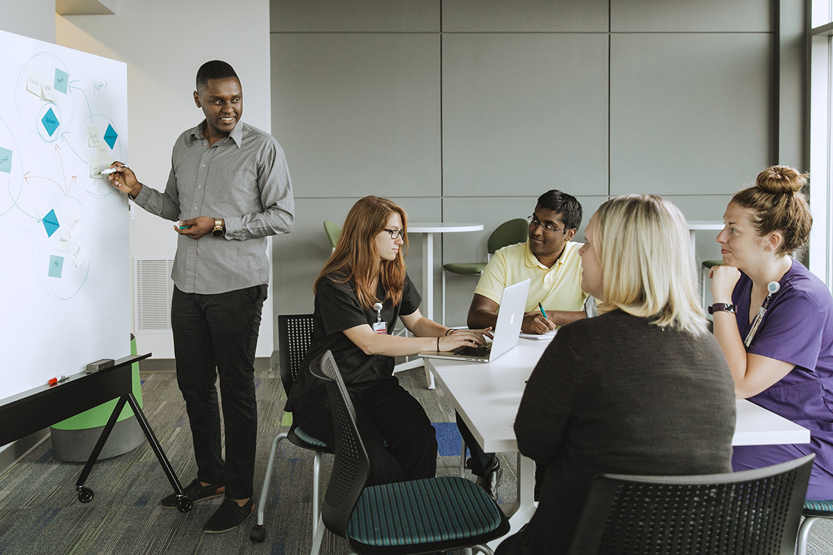 Group of researchers collaborating on ideas