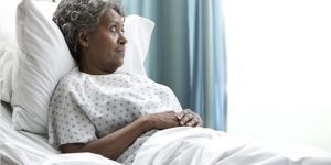 elderly woman laying in a hospital bed