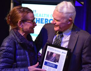 Dr. Kroenke is congratulated by Dr. Lisa Harris, CEO of Eskenazi Health