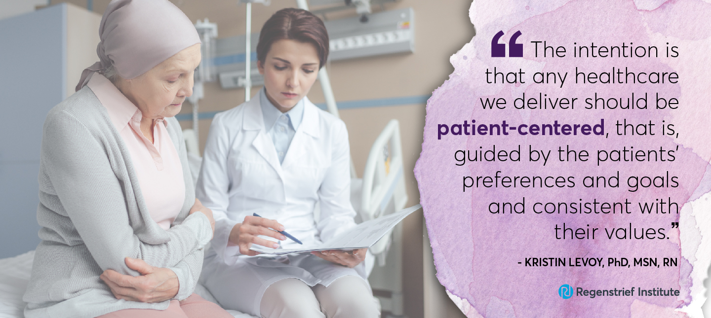 Doctor sitting with cancer patient going over paperwork