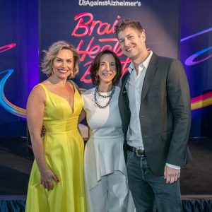 Dr. Fowler standing with Jill Lesser, President, WomenAgainstAlzheimer's, and a top health podcaster Max Lugavere.