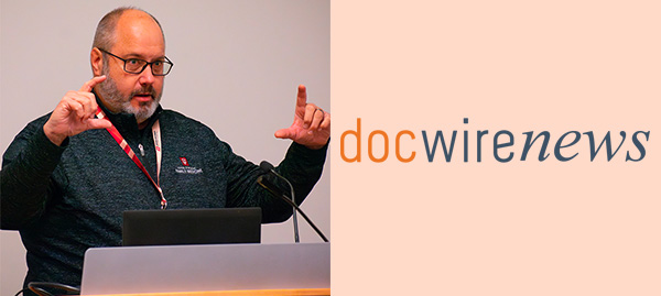 photo of Shaun Grannis speaking and DocWire news logo
