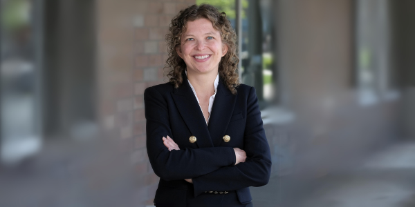 Rachel Patzer standing in front of the Regenstrief Institute building.
