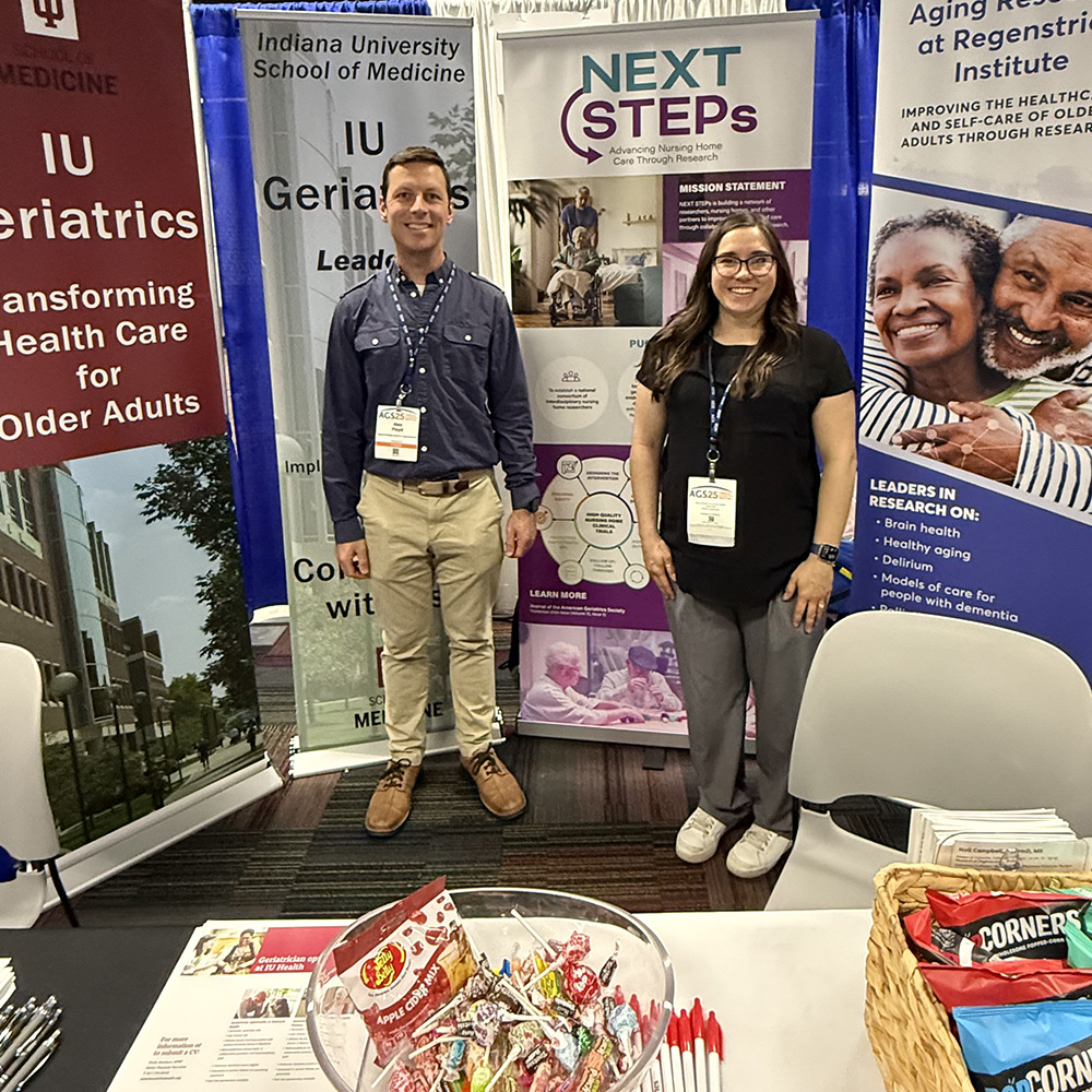 Regenstrief staffers Alex Floyd and Anna Higbie at the Center for Aging Research's booth at the 2025 American Geriatrics Society meeting. 